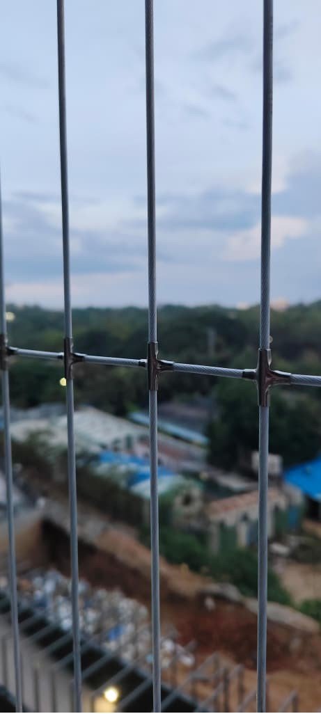Close view of stainless-steel invisible grill cable joints