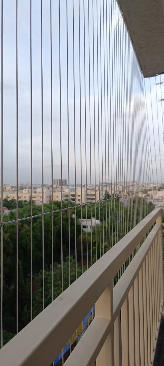 Invisible grill cables fitted across an apartment balcony