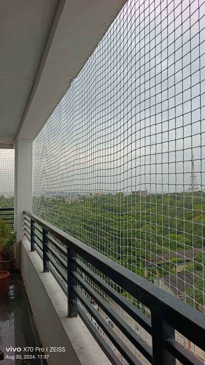 Safety net fitted across a high-rise balcony