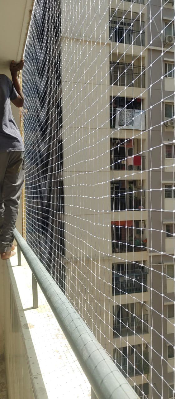 Puja Safety Nets technician fitting protective netting