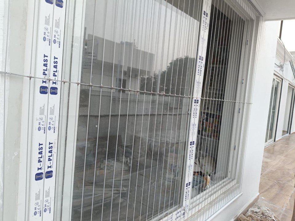 Invisible grill cables fitted across a large window